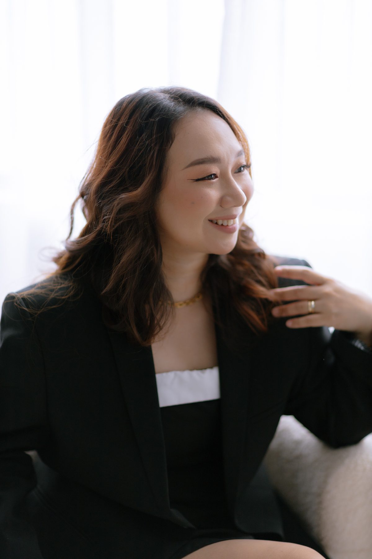 Aki laughing during a portrait session
